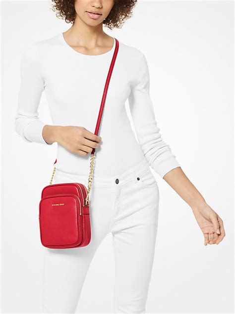 jet set travel medium pebbled leather crossbody bag 